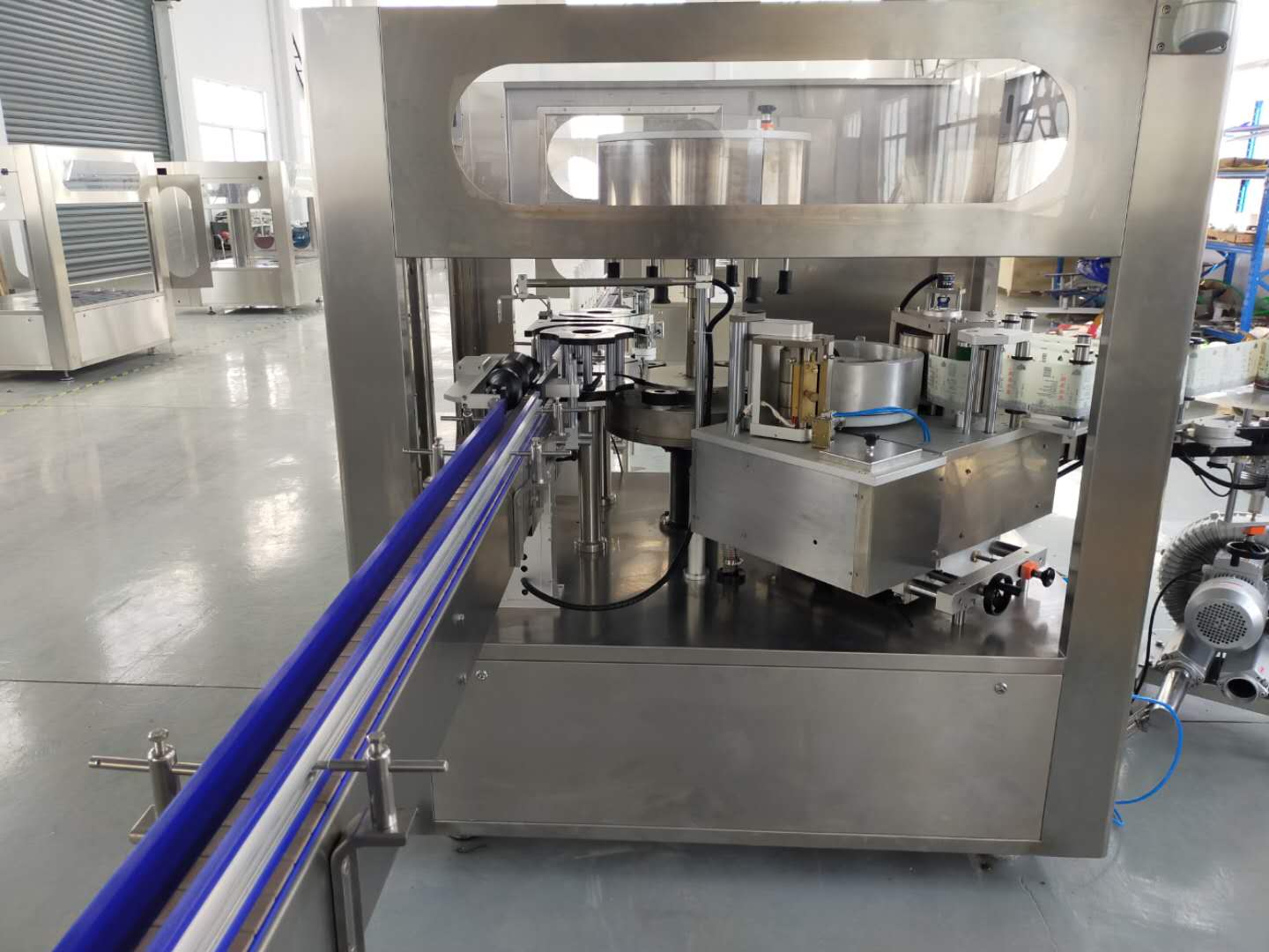 Mozambique customer ordered linear hot melt labeler machine